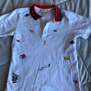 Gucci boys polo with traditional Gucci symbols